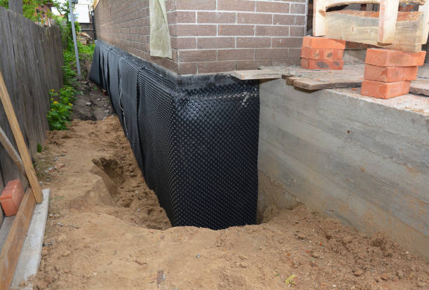 Happy homeowners after waterproofing job in Trenton